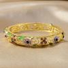 Artistic Ethnic Enamel Four Leaf Clovers Alloy Bracelet Featuring Drip Oil Craftsmanship Symbolizing Luck Love and Hope