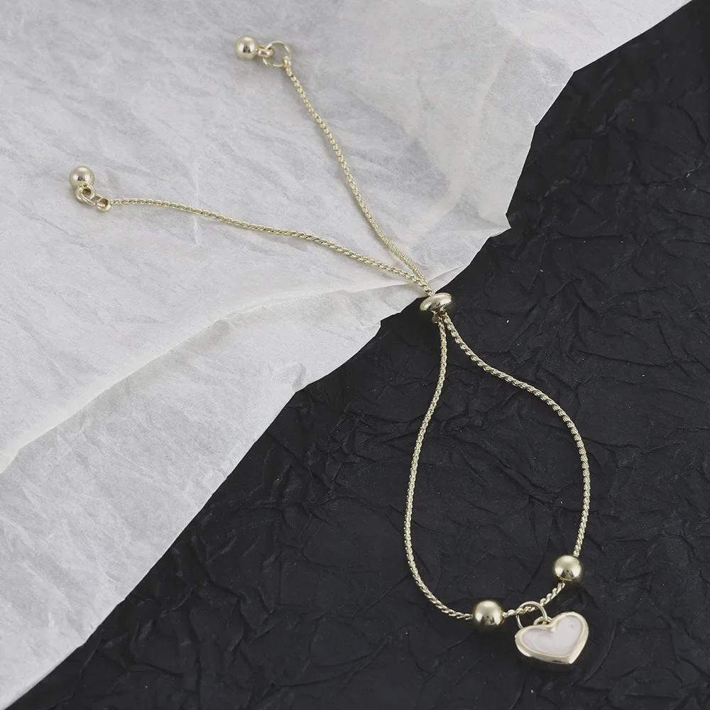 Słodka koreańska perła i brzoskwiniowa bransoletka z wisiorkiem w kształcie serca - modna, niszowa, czysto biała biżuteria dla dziewczynek