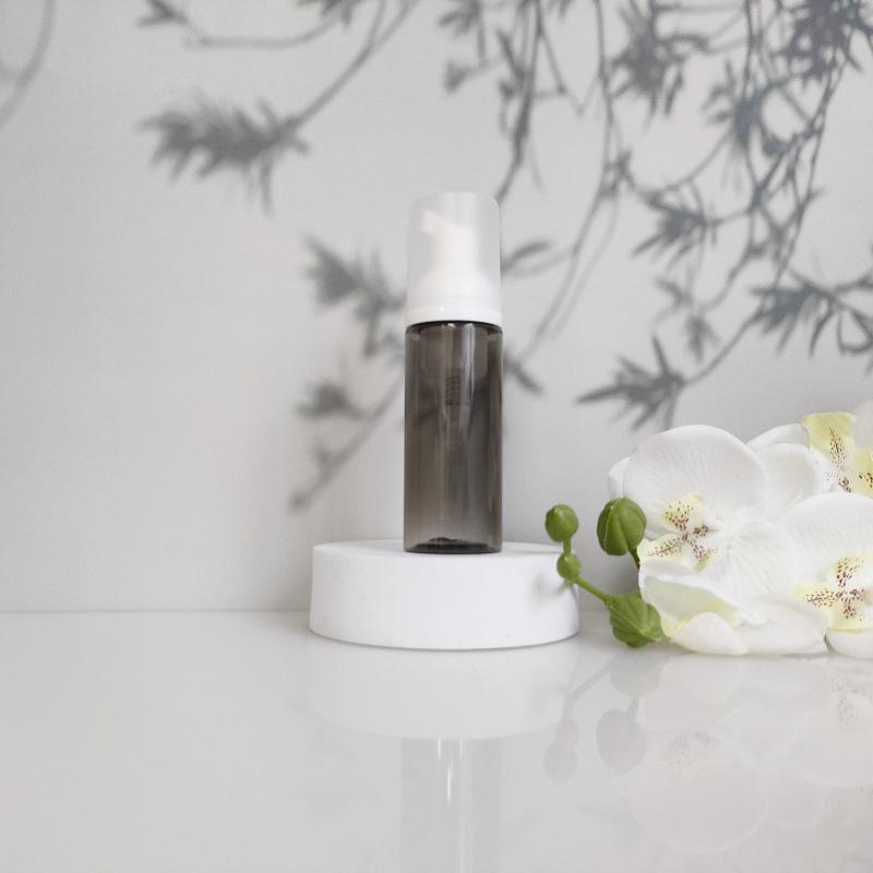 Available 60ml Transparent Black Foam Mousse Bottle for Face Wash and Travel-friendly Cosmetic Packaging.