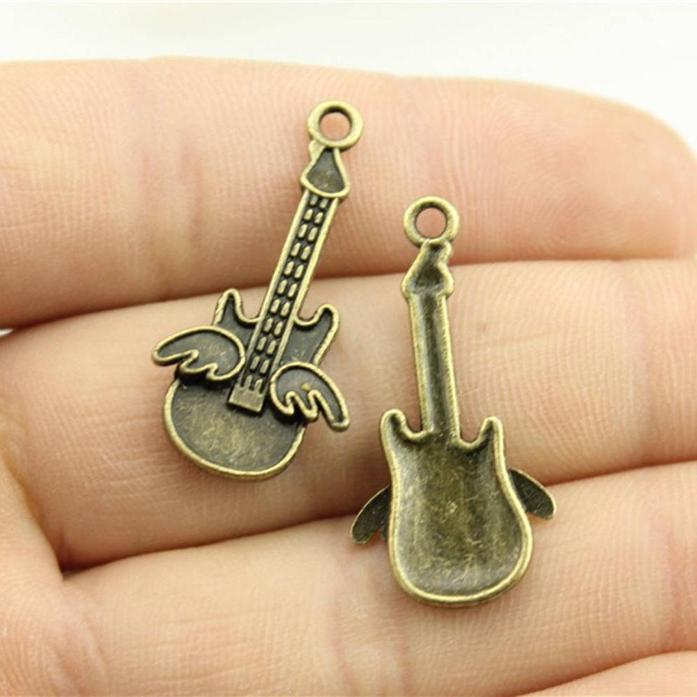 10 sztuk zawieszek muzycznych Instrumenty muzyczne Gitara Bęben Fortepian Mikrofon Zawieszki do tworzenia biżuterii