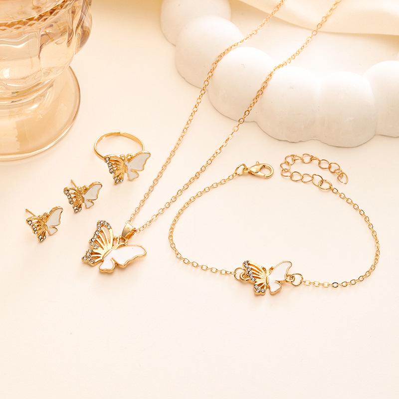 Elegancki Zestaw Biżuterii Motylkowej: Naszyjnik, Bransoletka, Pierścionek, Kolczyki