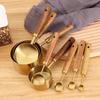 8-Piece Stainless Steel Measuring Cup & Spoon Set with Titanium Gold & Wooden Handles