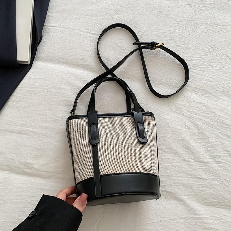 

Textured niche canvas contrasting color small bucket bag women s new messenger bag fashionable casual portable shoulder bag