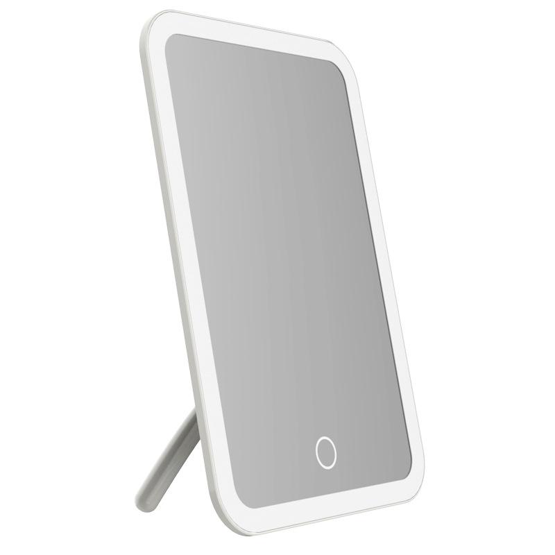 Peach LED Makeup Mirror with Intelligent Touch Dimming, HD Lighting, and Rechargeable Function.