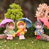 Cartoon Girl Raincoat Figurine: Cute Umbrella-Holding Doll for Desktop or Car Decor
