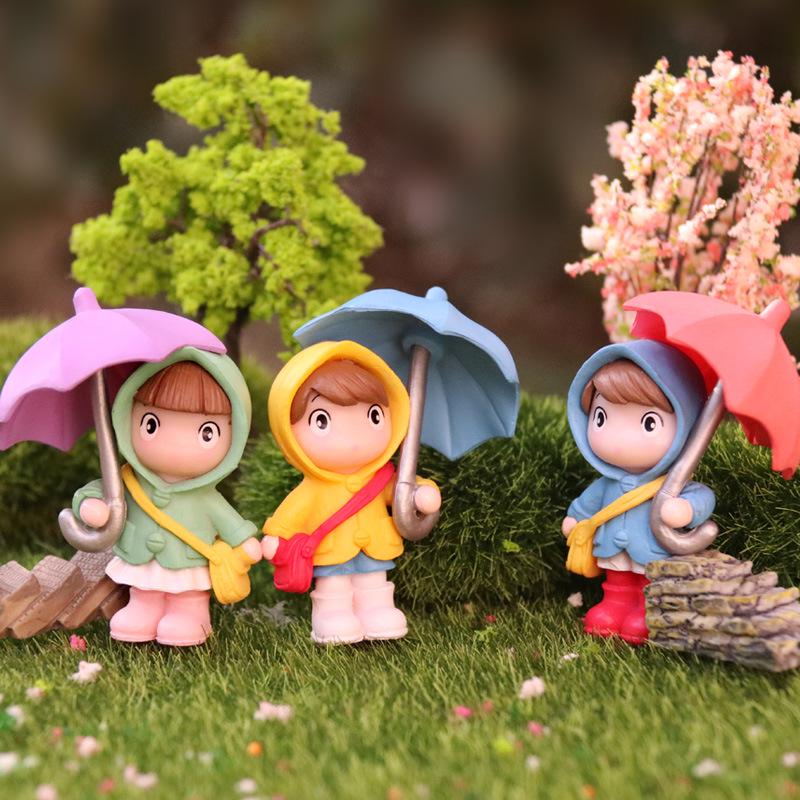 Cartoon Girl Raincoat Figurine: Cute Umbrella-Holding Doll for Desktop or Car Decor