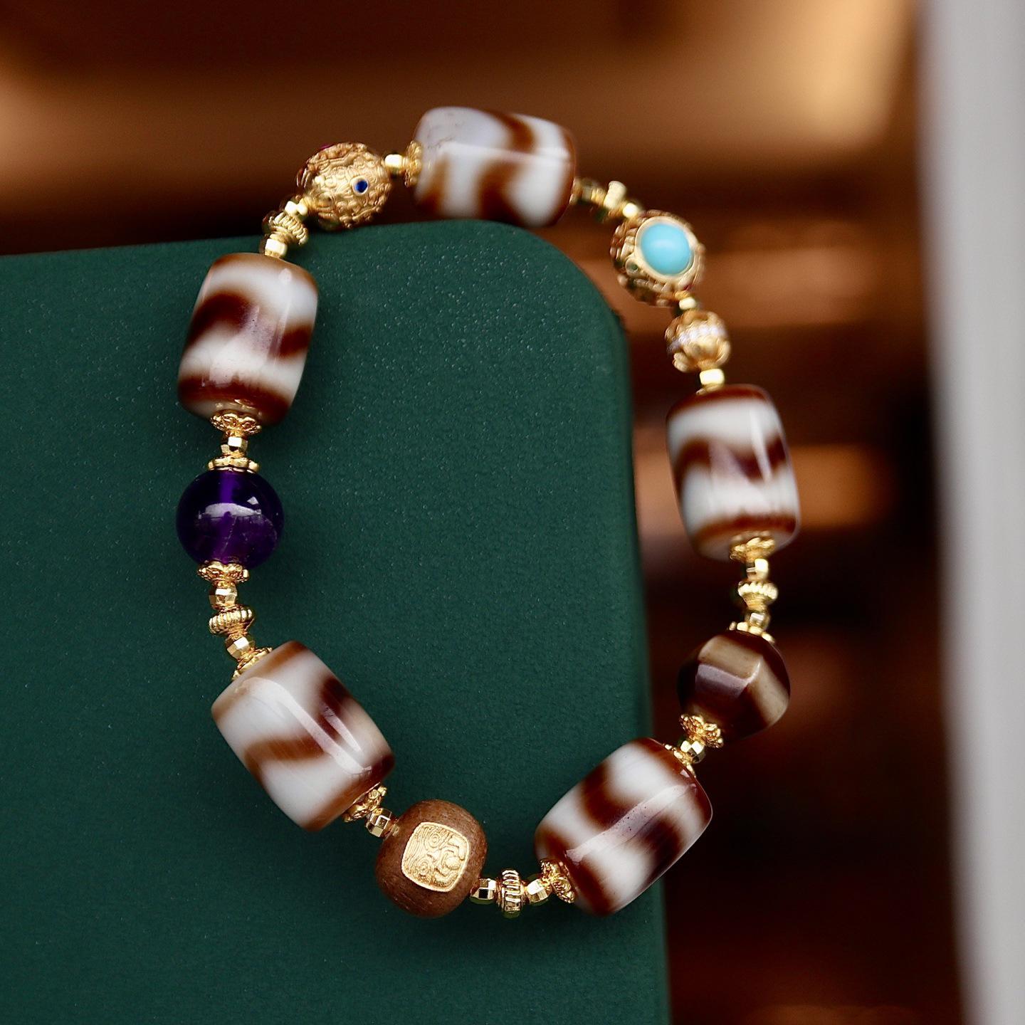 Универсальный браслет с бусиной Дзи «Множество сокровищ», клыком тигра и агатом
