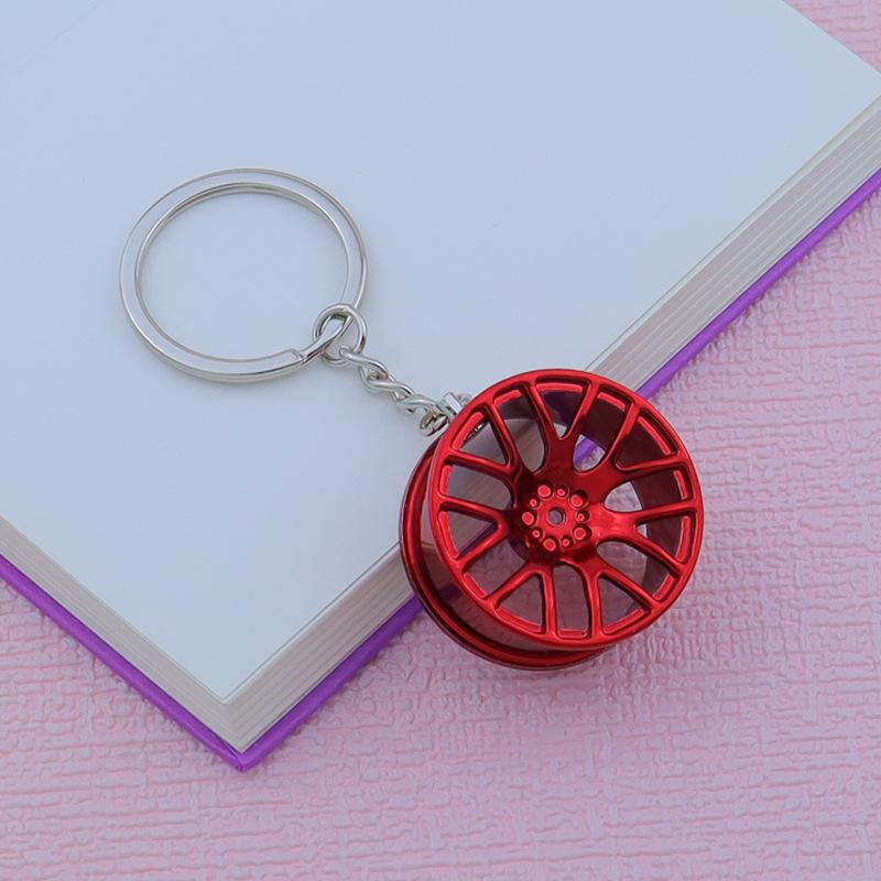 Creative Car Wheel Hub Keychain: Zinc Alloy Metal, Customizable Gift.