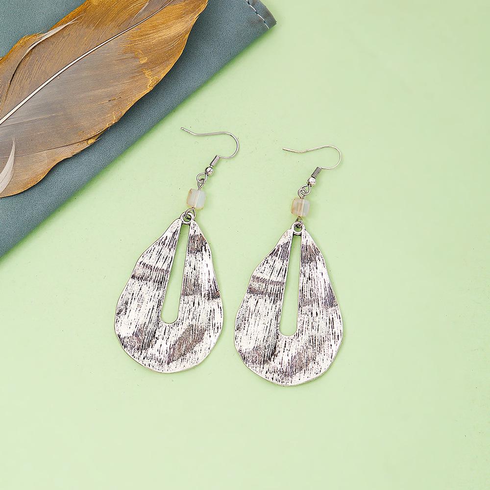 Retro Irregular Water Drop Earrings: Alloy Brushed with Unique Textured Design for Women