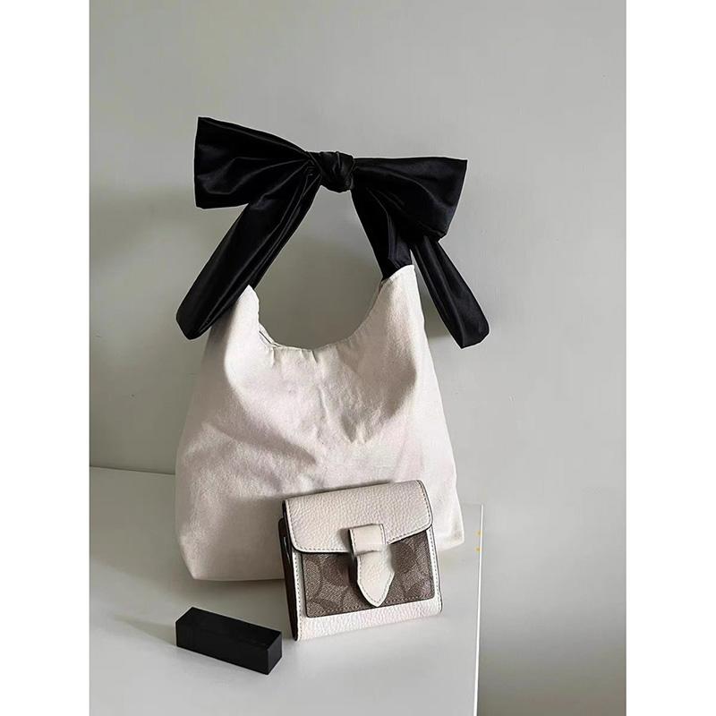 Geantă de mână cu arc de designer coreean, de nișă simplă, de vară, geantă de pânză nouă, la modă, de capacitate mare, o geantă de cumpărături, geantă de umăr pop