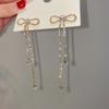 High-End Heart Tassel Earrings: Slimming, Long Dangle for Round Faces - Luxurious and Niche Design