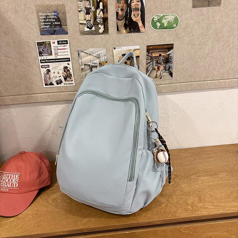 Casual solid color large-capacity schoolbag 2025 new versatile junior high school backpack college student travel backpack tide
