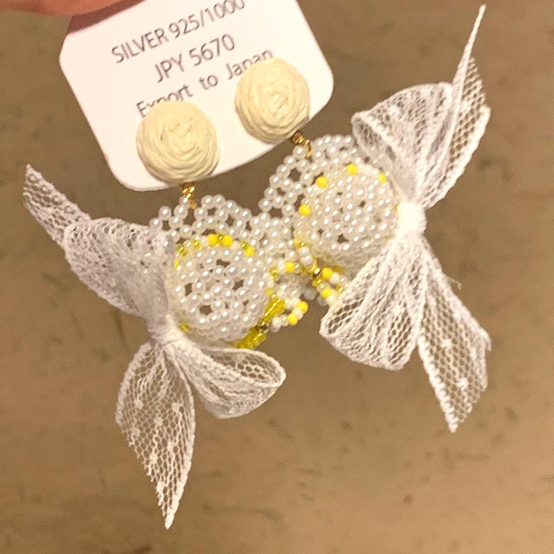 

Серьги-пусеты с подвеской в виде банта из рафии и жемчуга Серебряная игла темпераментные модные нишевые серьги универсальные