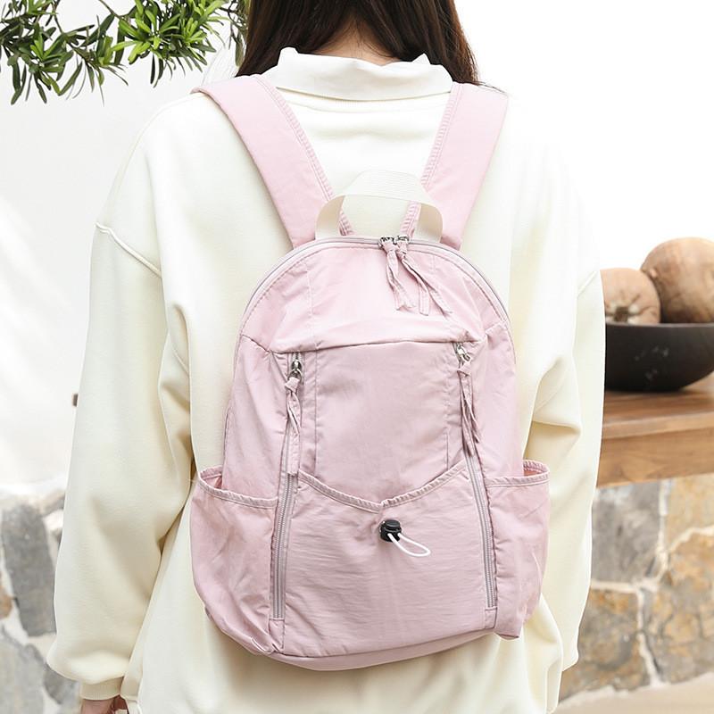 

IELGY Японский повседневный рюкзак из холста, модный нейлоновый рюкзак со шнурком в стиле знаменитости из Интернета, плиссированный рюкзак из ткани Оксфорд розовый