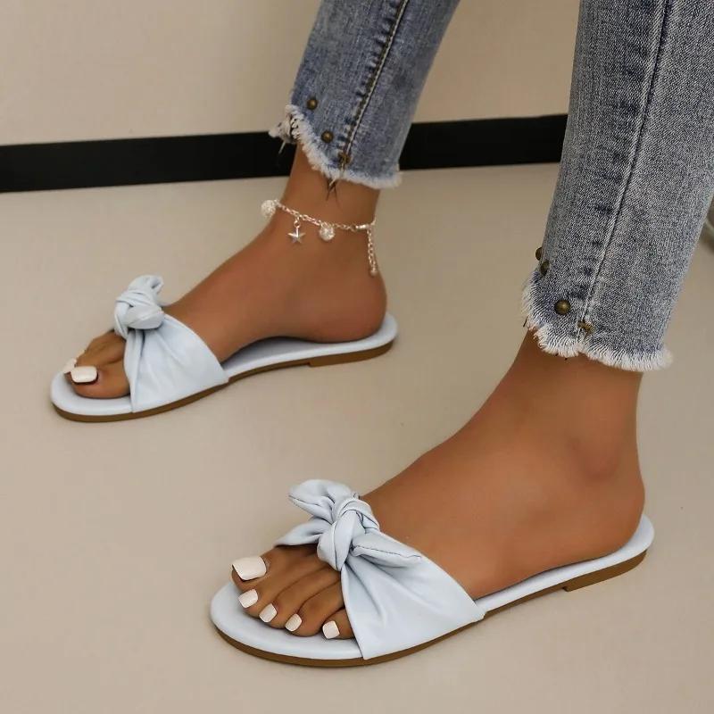 Модне взуття для жінок 2024 Гарячий розпродаж Жіночі шльопанці з відкритим носком Літні з бантом Однотонні Вуличні Повсякденні Пляжні Плоскі Зручні Шльопанці