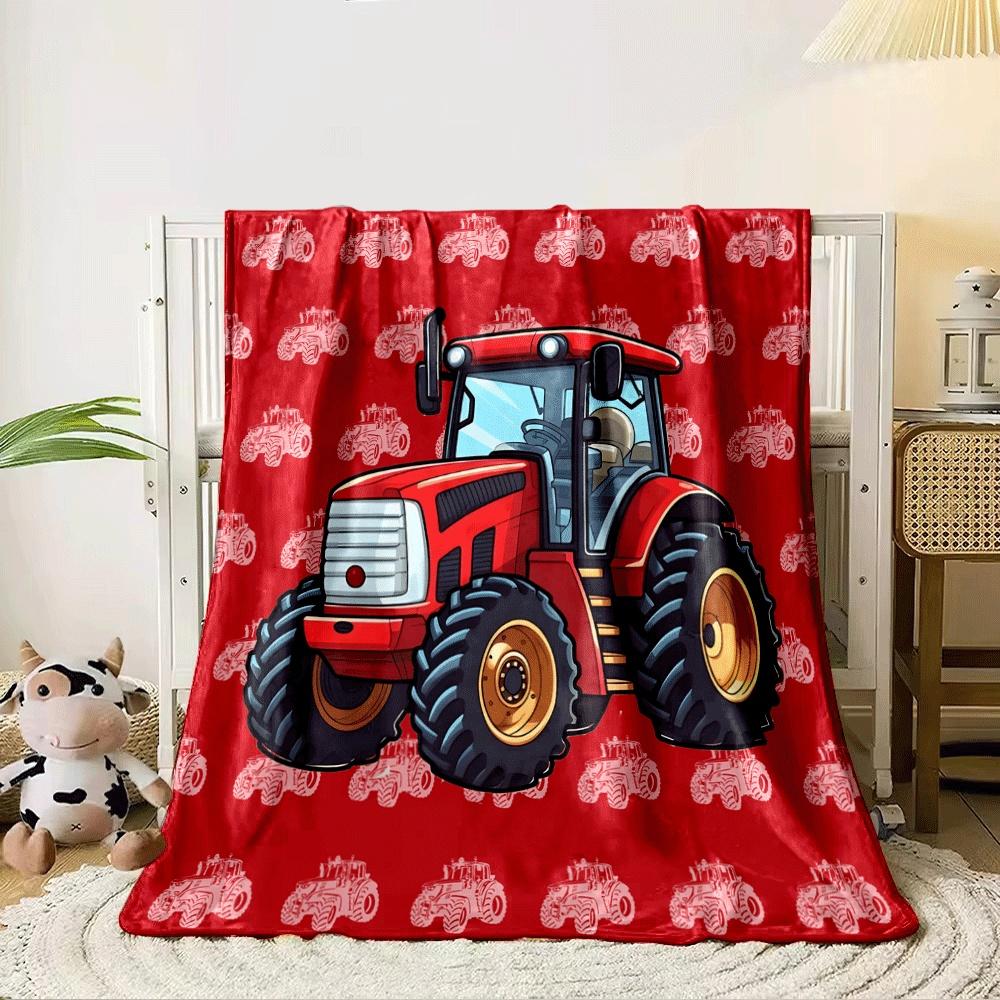 Red tractors repeat as a pattern on a red background with a central focus. for all seasons blanket lunch break throw gift 80cm x 120cm