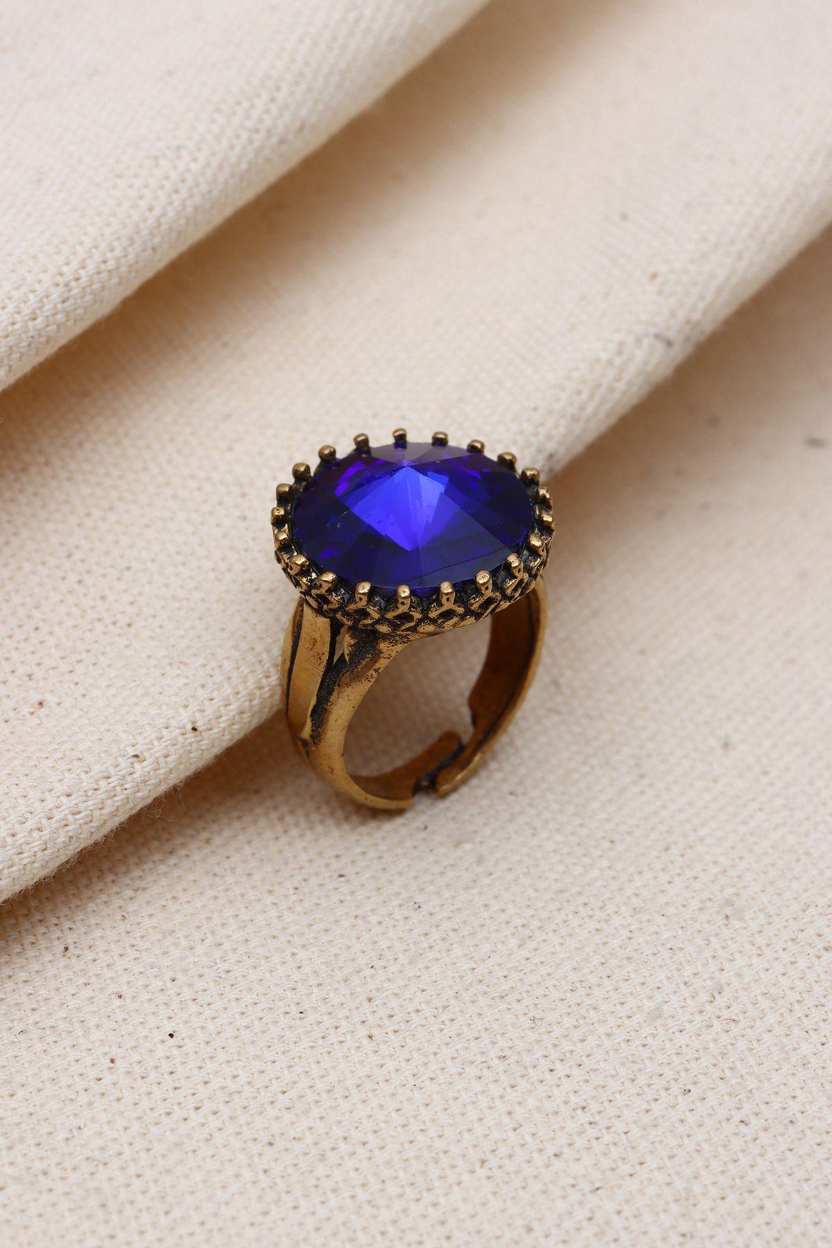 

Регулируемое подлинное кольцо с темно-синим круглым камнем