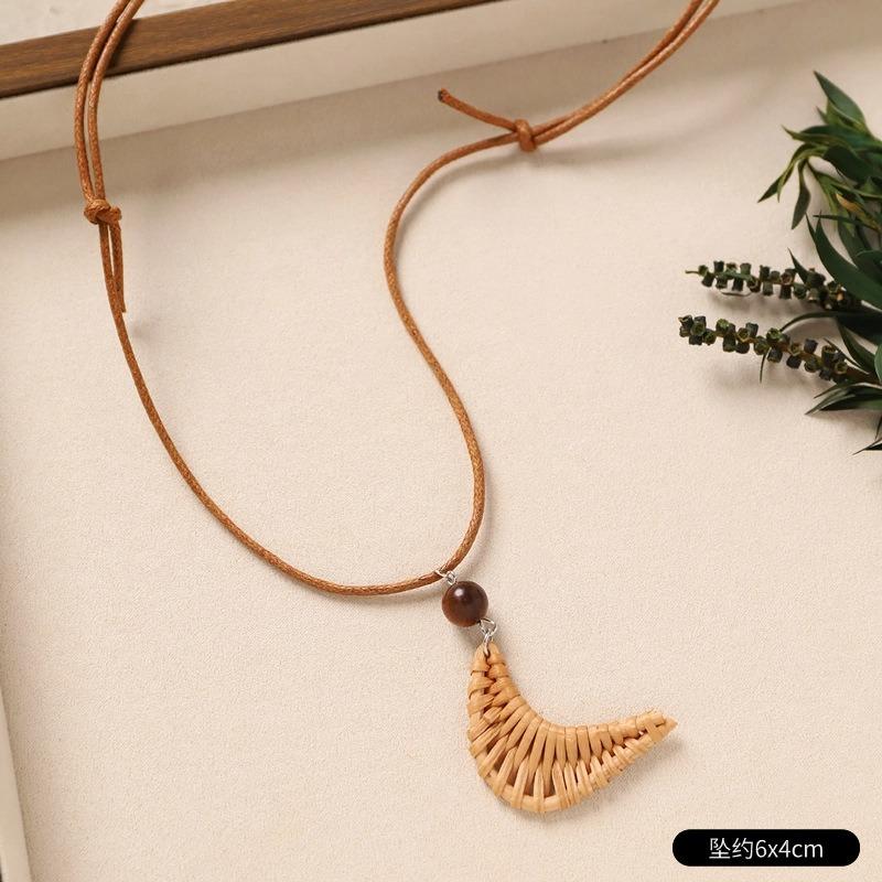

Bohemian vacation rattan necklace niche design weaving long seaside accessories sweater chain women