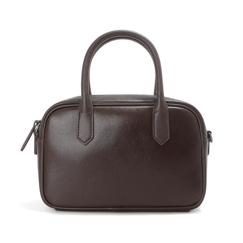 

2026 Cowhide Boston Bowling Bag Women, Retro Black Commuter Hand-held Crossbody Designer Luxury Bag 23x9x14cm