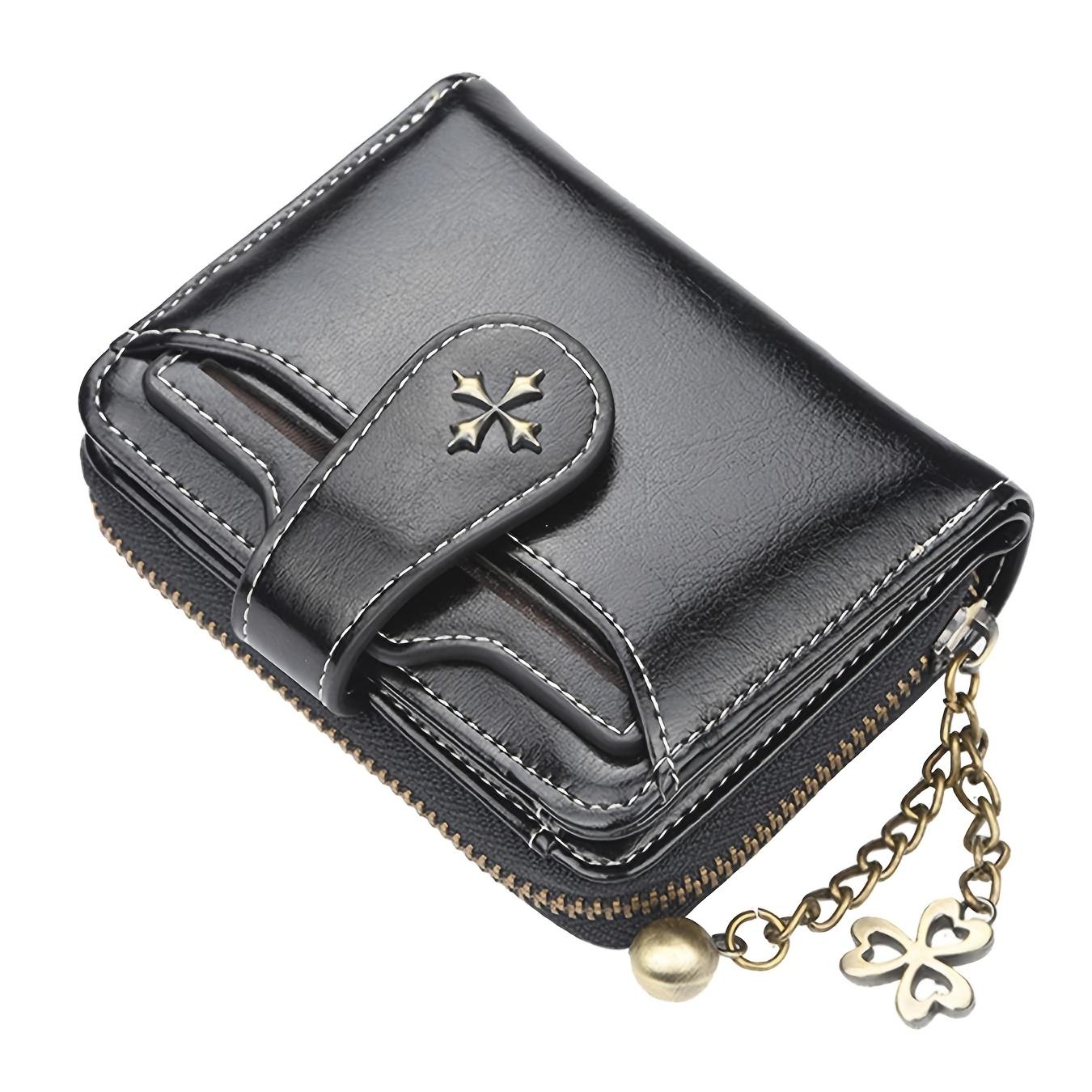 

Женский короткий кошелек в классическом и ретро стиле. имеет простой дизайн с фурнитурной отделкой и подходит для повседневного использования. множество слотов для карт. чёрный