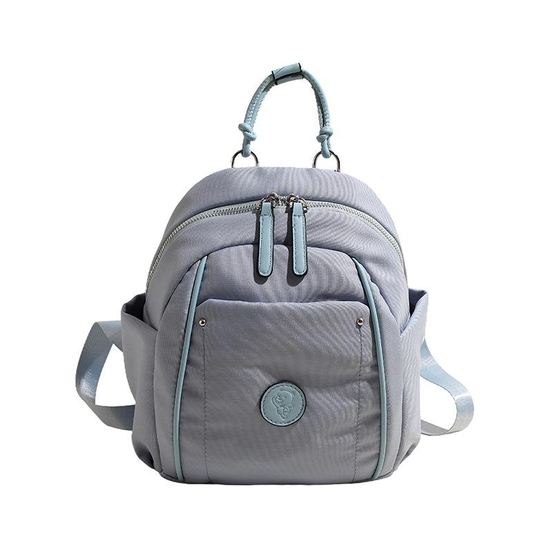 

Casual lazy wind nylon cloth bag women s bag 2024 new simple and versatile backpack travel commuter bag синій