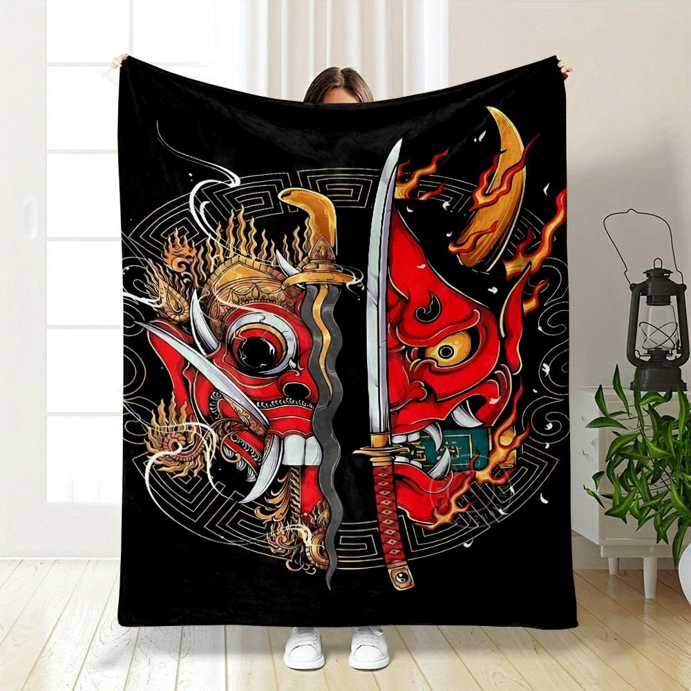 Fiery red demon masks split by swords, surrounded by ornate golden designs. for all seasons blanket lunch break throw gift