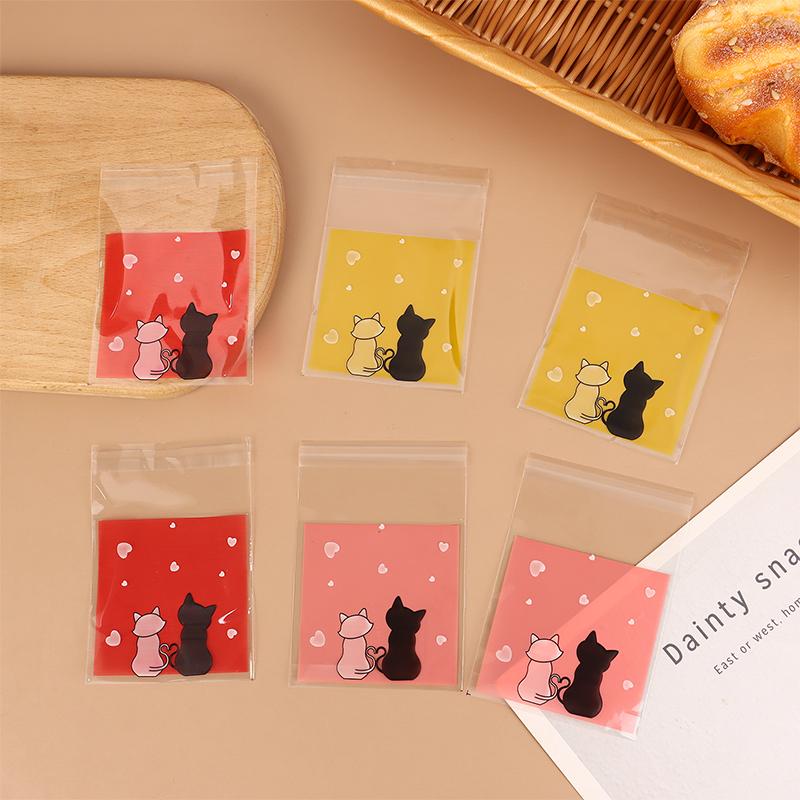 100 Stück Mini-Cartoon-Kekstüten zum Backen, Snacks, selbstklebende Tüten, Pärchen, Katzen, Kekse, Süßigkeiten, Schmuck, Geschenkverpackung, Plastiktüte