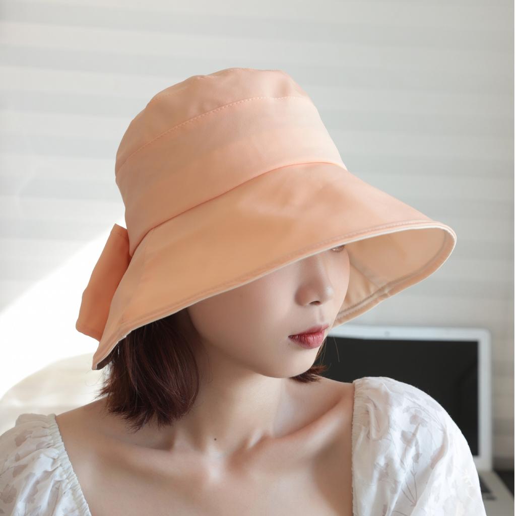 Sunscreen hat women's spring and summer UV protection sunshade bucket hat bow British eaves elegant versatile sun hat