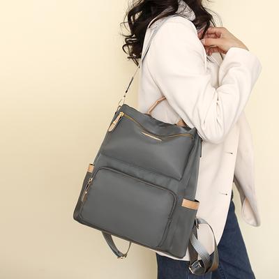 Ein leichter, einfacher, multifunktionaler Reise-Crossbody-Rucksack mit großer Kapazität, aus Stoff, zum Tragen über einer Schulter