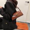 2024 Ny Tidlig vår Ny Arbeid Pendling Uformell Lett liten veske Fasjonabel liten firkantet veske for kvinner Nisje skulderveske