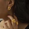 Gold Plated Titanium Steel Earrings with Rotating Thread Ring Design and Diamond Inlay