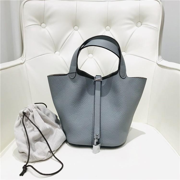 2023 Nowa damska torba ze skóry bydlęcej pierwszej jakości, wzór liczi, koszyk warzywny, worek typu bucket bag, modna i prosta, codzienna torebka