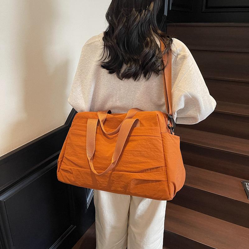 Large capacity travel bag women's fashion lightweight waterproof yoga fitness bag short trip travel luggage bag boarding bag