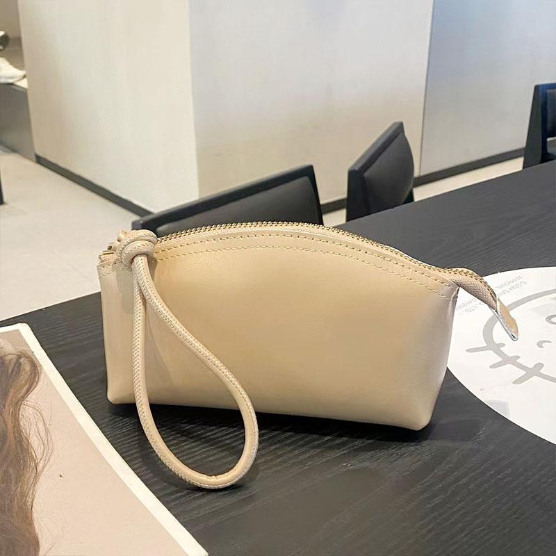 Handheld wallet New leather casual dinner bag First layer cowhide cosmetic bag Fashion versatile women's bag