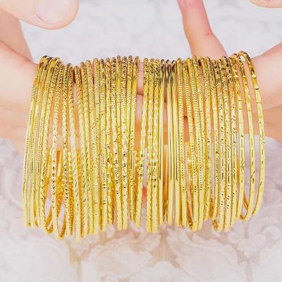 Bracciale a spirale in oro da donna vietnamita: Resistente imitazione dell'ottone, gioielli "Tre vite, tre mondi".