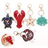 Nuovo Ciondolo a Forma di Aragosta con Strass e Perline Borsa Carina Cucita a Mano Charms Gusci di Granchio Tartaruga Cordino Appeso Toppe Applicazione Cordino per Borsa