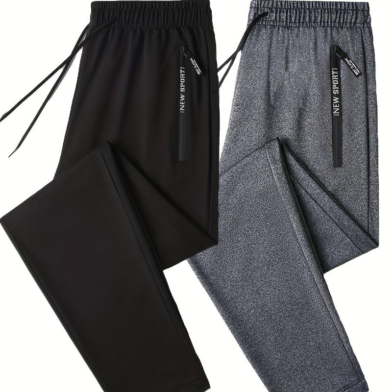 

Мужские однотонные спортивные брюки-джоггеры обычного кроя - эластичная полиэстеровая ткань, карманы на молнии с буквенным принтом M