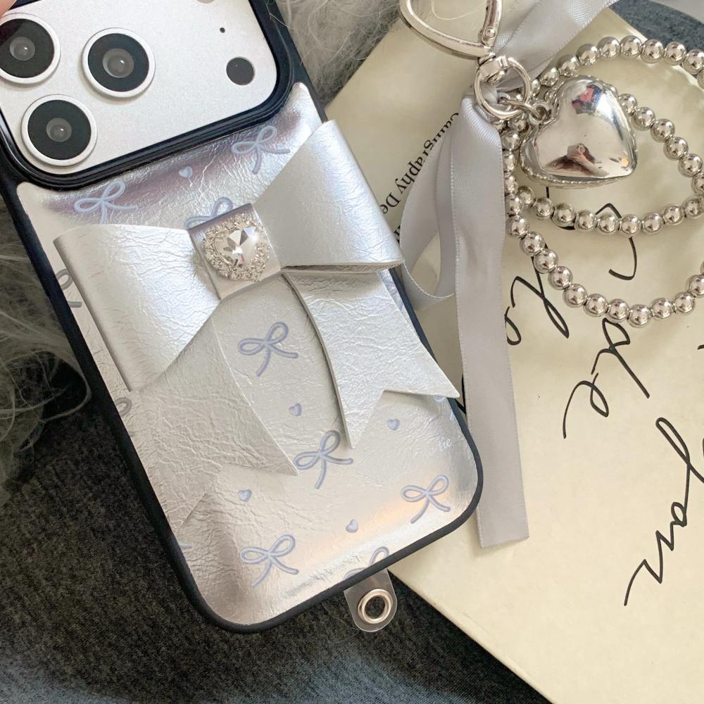 Korean ins silver leather three-dimensional bow, suitable for Apple 17 mobile phone case, new iPhone17promax high value 15 trend 14 flash diamond 13