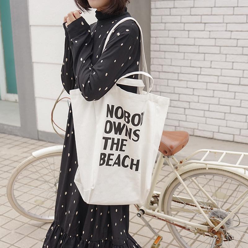 

E Korean version of literary and simple letter shoulder canvas bag female student largecapacity portable shopping bag белый