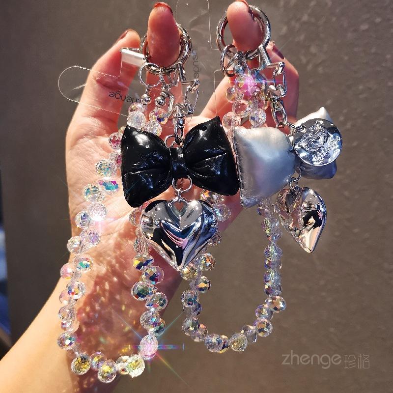 Small fragrance bow tie, love mobile phone hanging chain, ins mobile phone case, pendant, beaded chain, short fashion women's wrist ornament