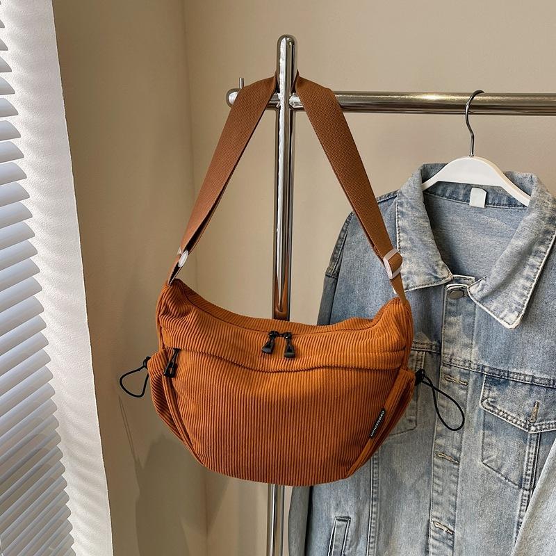 

Corduroy autumn and winter crescent leisure bag messenger bag women s versatile dumpling bag solid color light travel shoulder bag коричневый