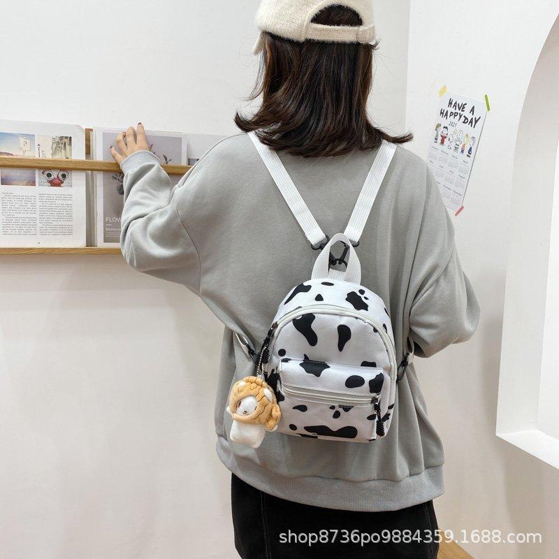 Schoolbag wholesale cow pattern canvas bag female messenger, new versatile ins wind shoulder bag Korean version Mori multi-purpose small backpack