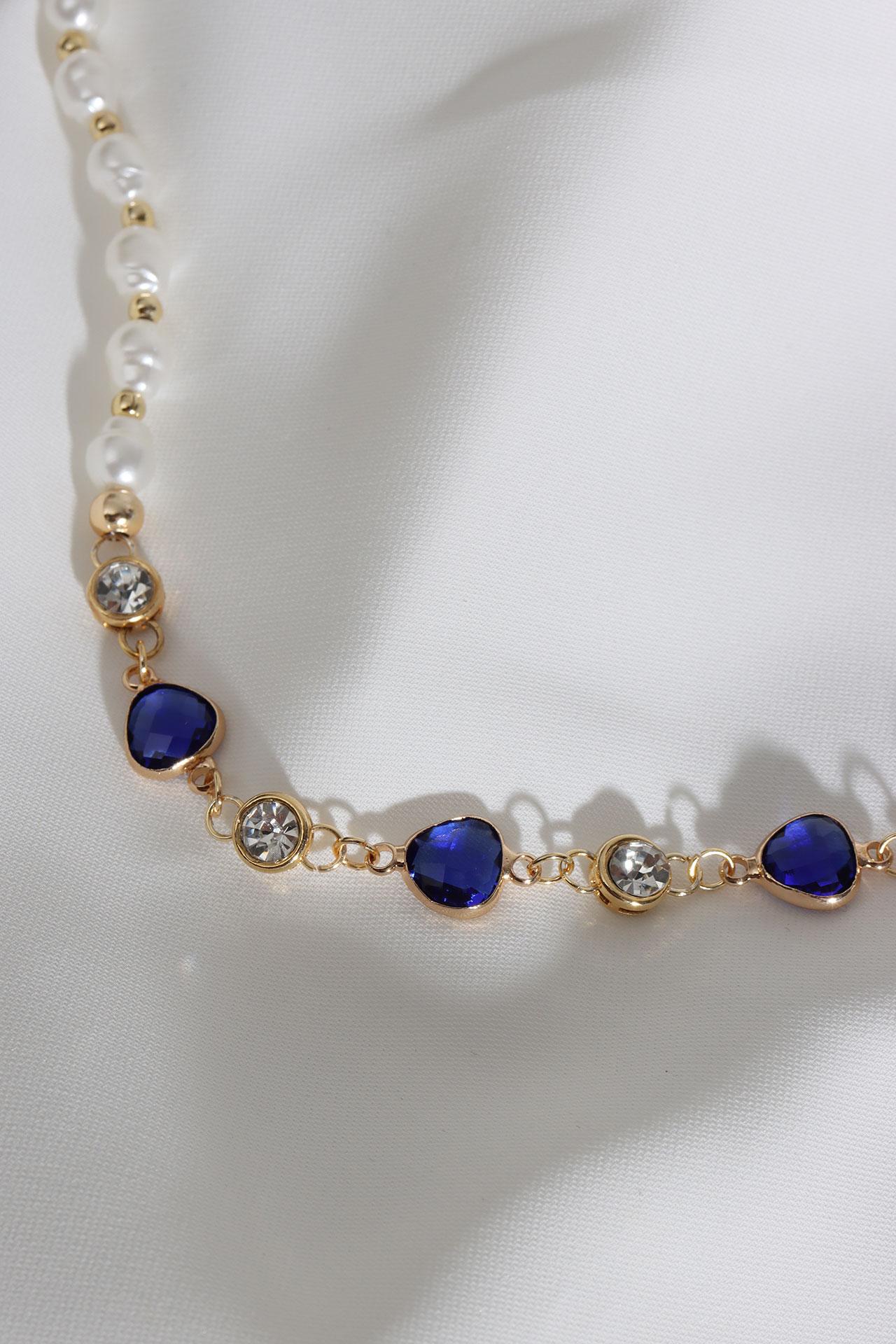 

Темно-синее жемчужное ожерелье с треугольными камнями