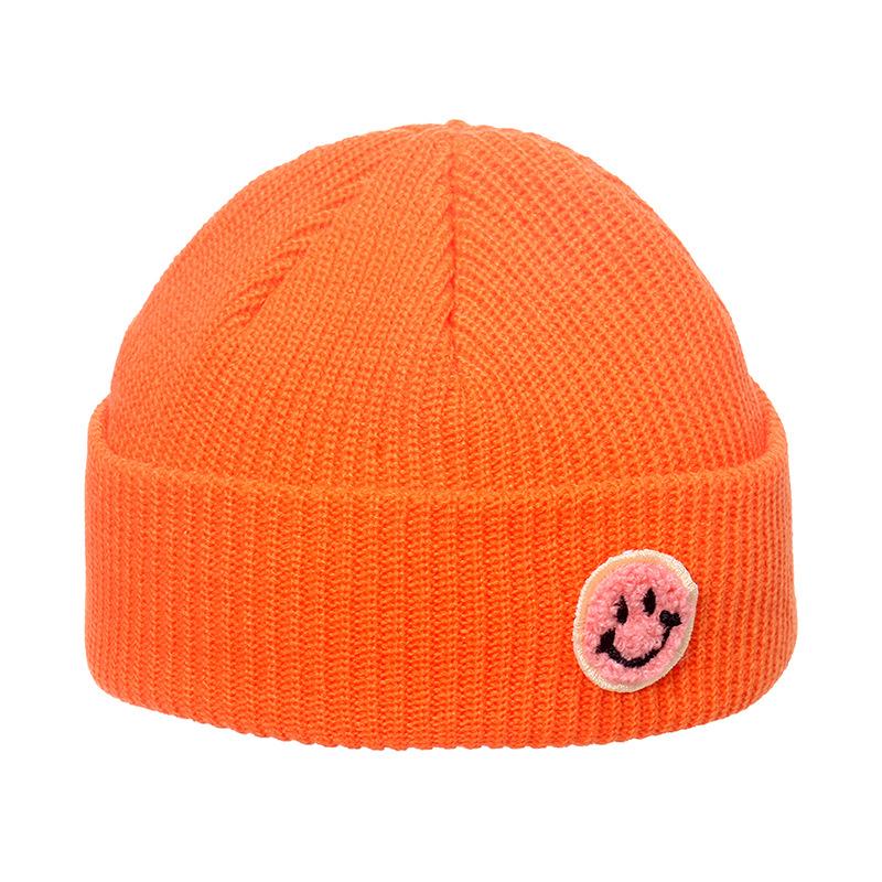 Autumn and winter wool hat male trend Japanese and Korean yuppie knitted warm smiley face sticker landlord hat candy color melon fur hat female