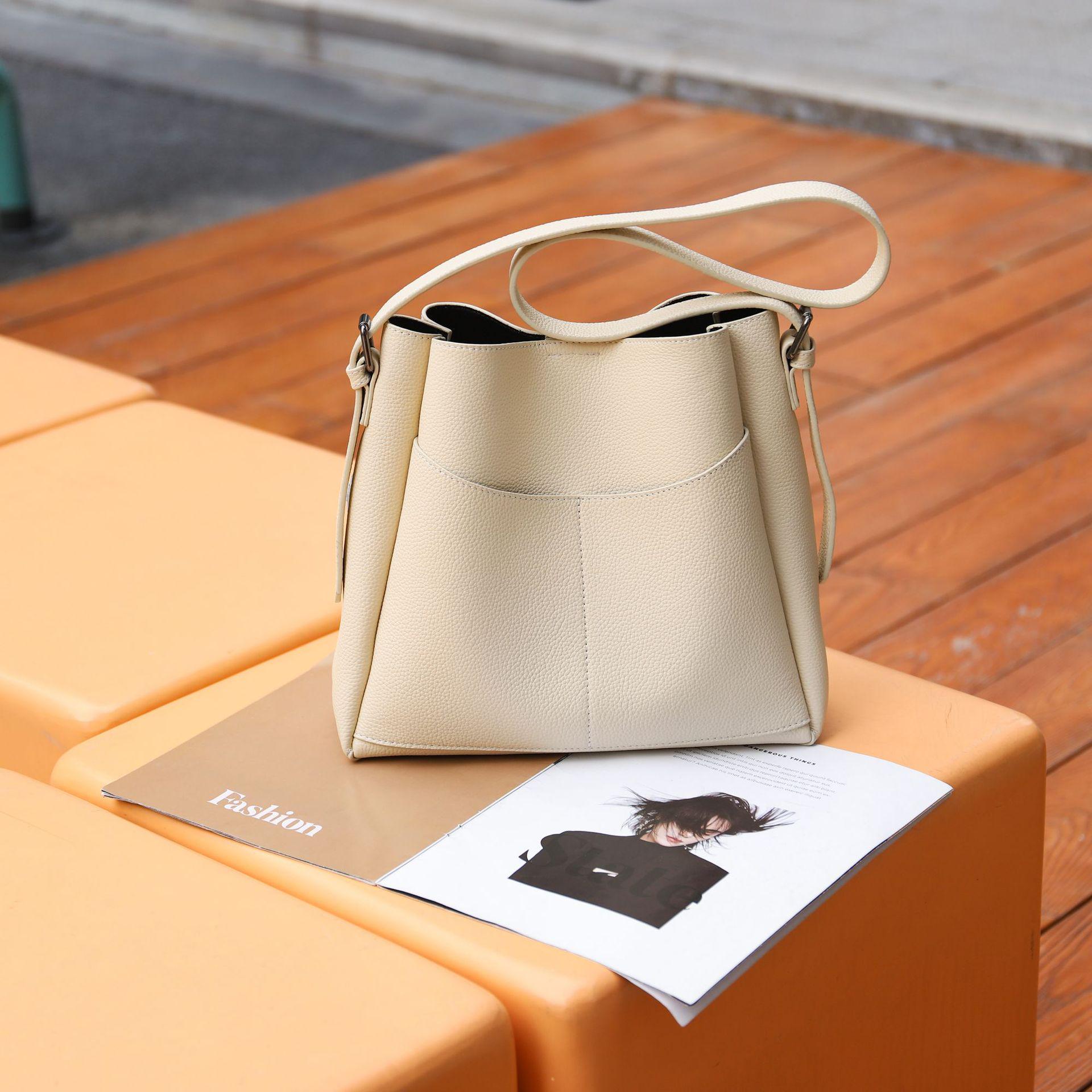 

Женская сумка через плечо из натуральной кожи в корейском стиле 2025 года — простая, повседневная, модная универсальная сумка-ведро для мамы и дочки.