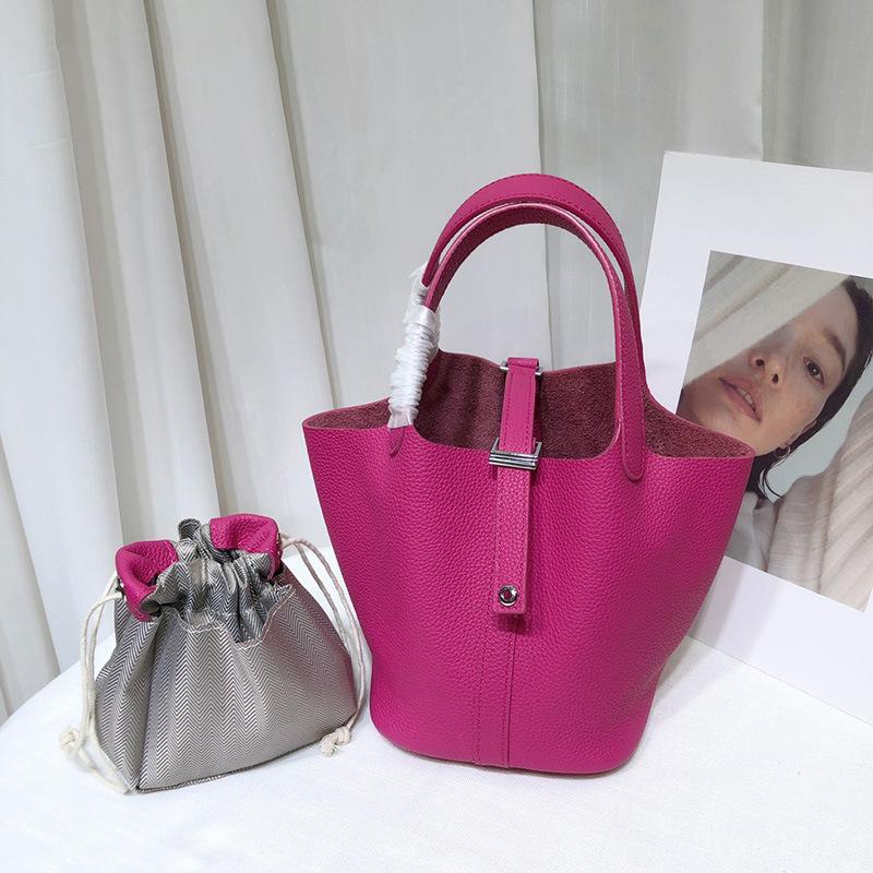 Spot wholesale top layer cowhide vegetable basket bag leather bucket bag commuter fashion lock buckle hand-held handbag woman