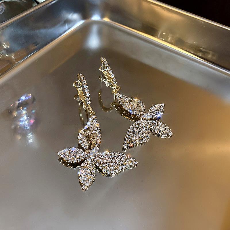 Diamond zircon butterfly earrings, ear buckles, hollow design earrings, fashion trend earrings.