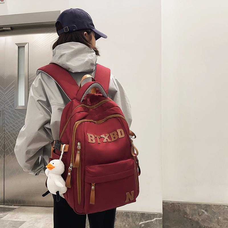 Large-capacity multi-layer schoolbag, junior high school students, girls, boys, high school students, load reduction ridge protection
