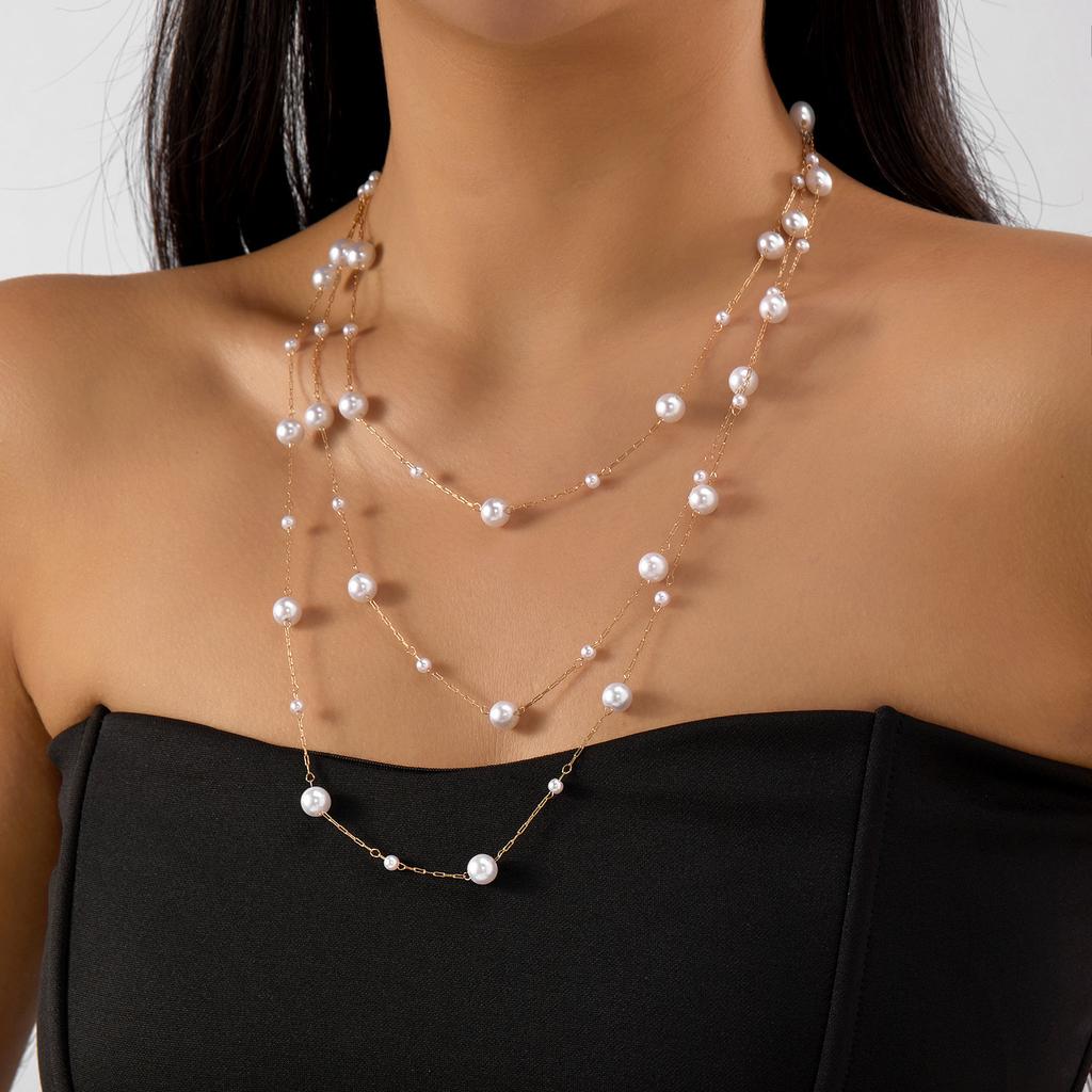 Stacked pearl necklace collection European and American retro baroque special-shaped pearl OT buckle blade snake chain tassel