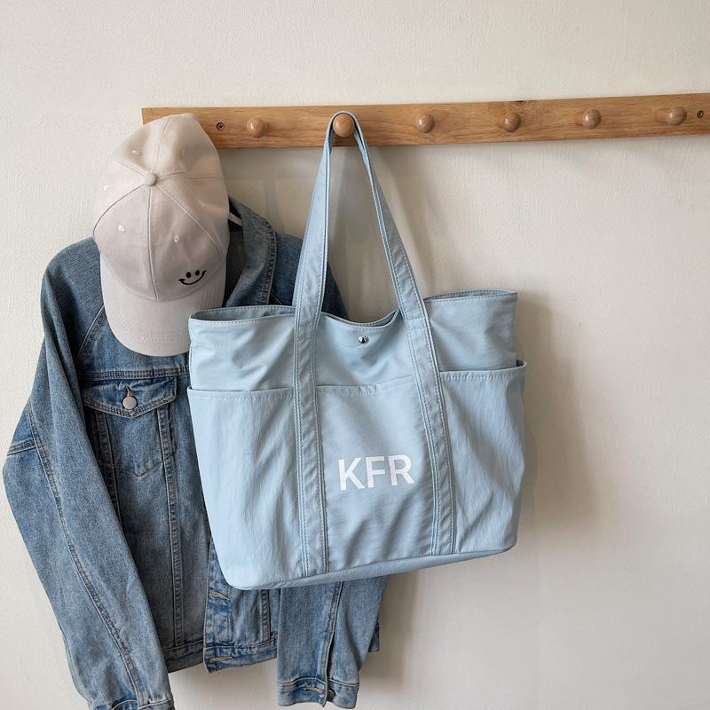 

Korean version solid color large-capacity tote bag 2025 new casual simple shoulder bag lightweight nylon student tote bag